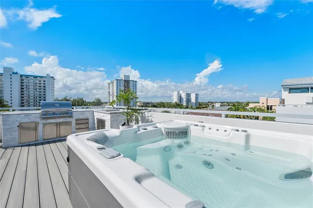 a view of a kitchen with a sink and a stove top oven