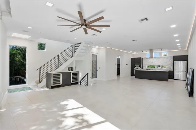 a kitchen that has a sink a stove and microwave