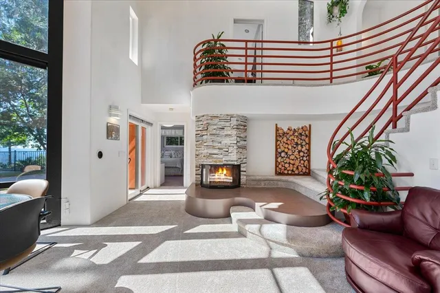 a kitchen with stainless steel appliances granite countertop a sink a stove and cabinets