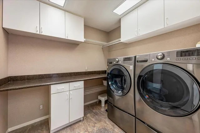 a bedroom with a bed window and a desk