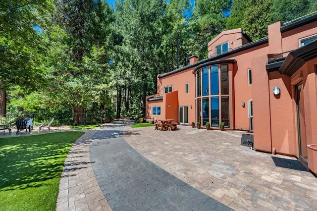 a view of a backyard with sitting area