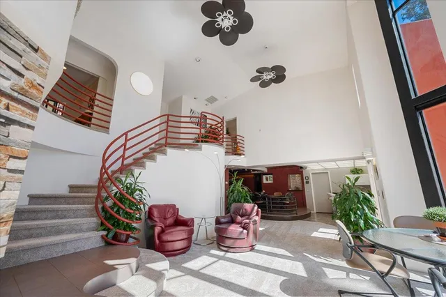 a room with furniture and dresser