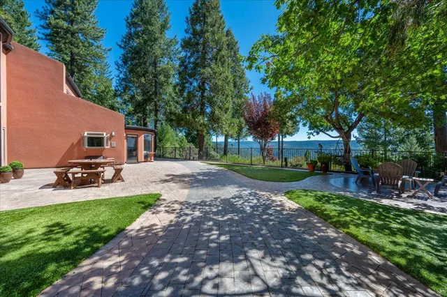a view of park with trees in the background