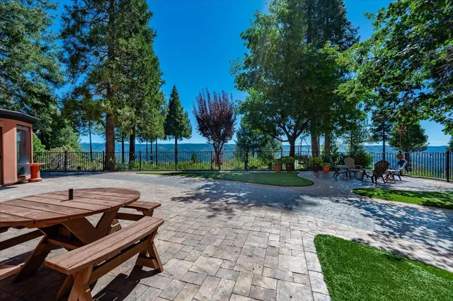 a view of a backyard with sitting area