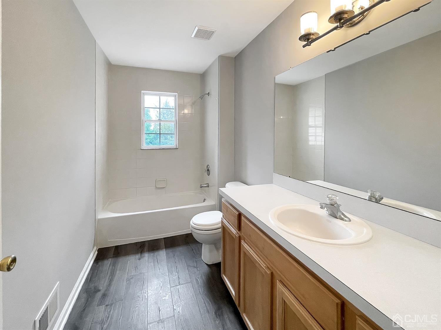 1 Cannon Road Old Bridge, NJ 08857 - Photo 20 of 23 a bathroom with a sink a toilet a tub and a mirror