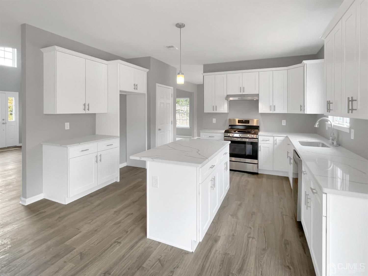 1 Cannon Road Old Bridge, NJ 08857 - Photo 6 of 23 a large kitchen with stainless steel appliances granite countertop a stove a sink dishwasher and a refrigerator