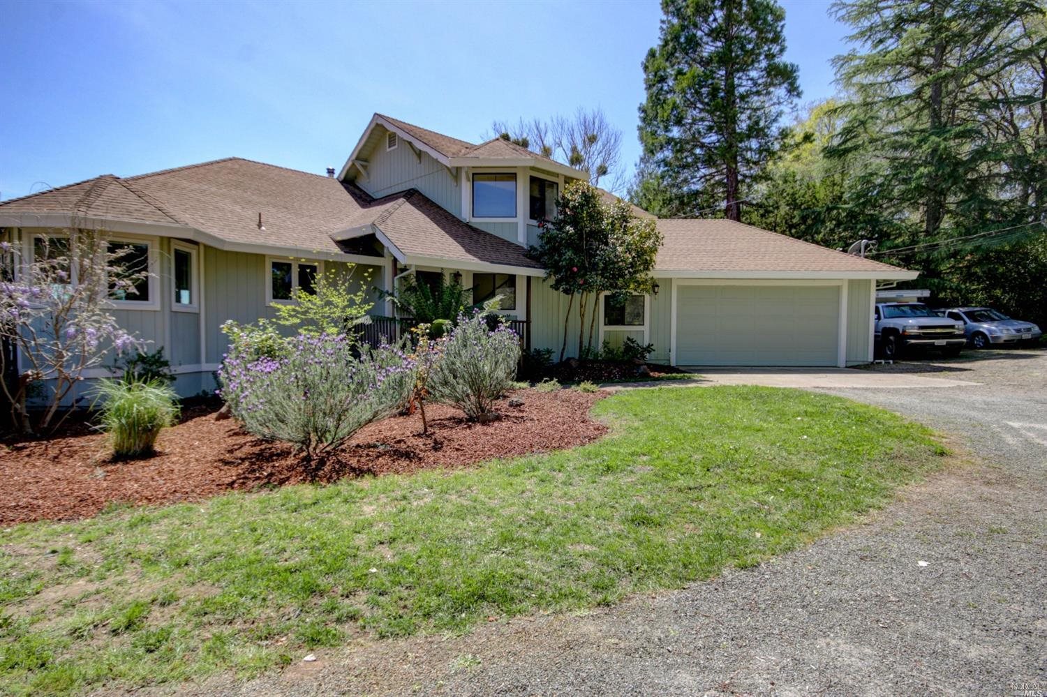 9343 Ross Station Road Sebastopol, CA 95472 - Photo 1 of 1 a front view of a house with a garden and porch