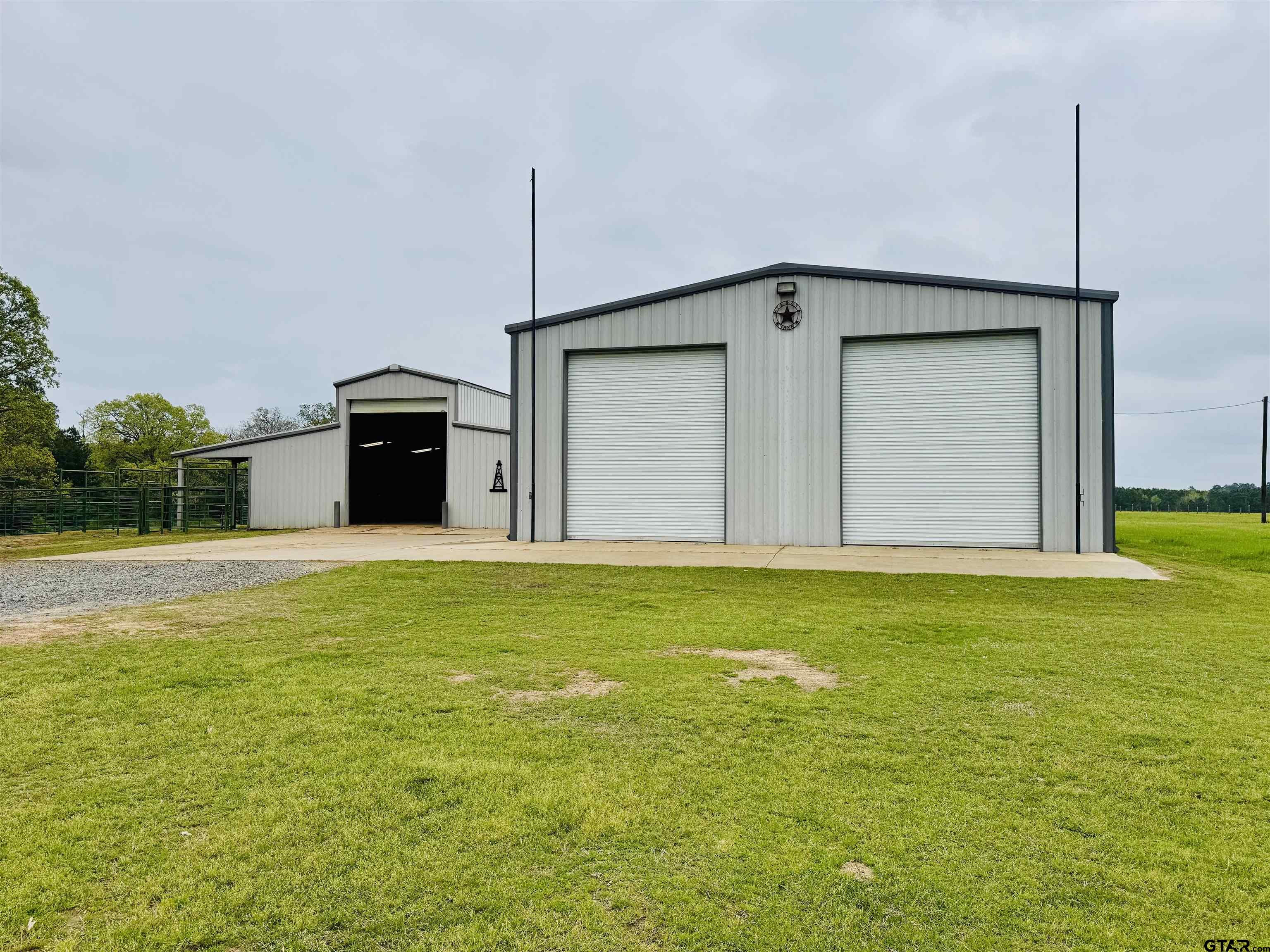 2268 County Road 4113 Henderson, TX 75654 - Photo 9 of 48 60x40 Shop electric, water, septic, RV Hookups, 50 amp service.3-14 ft overhead doors, 1-10ft door