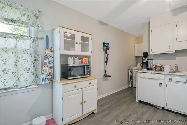 a kitchen with stainless steel appliances a stove and cabinets