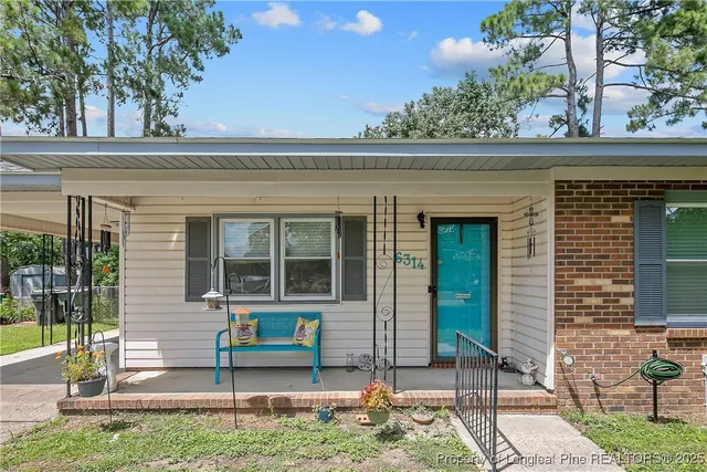 a front view of a house with a porch