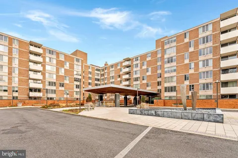 a view of a building with a street