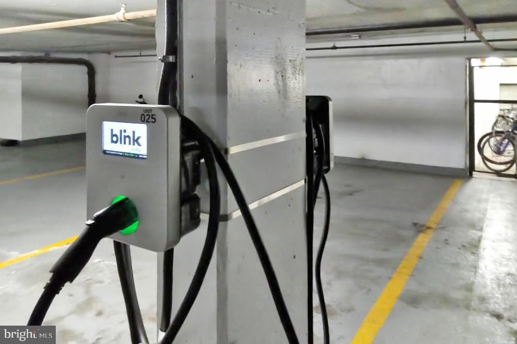 2939 Van Ness Street Northwest, Unit 845 Washington, DC 20008 - Photo 21 of 22 a view of staircase with a rug
