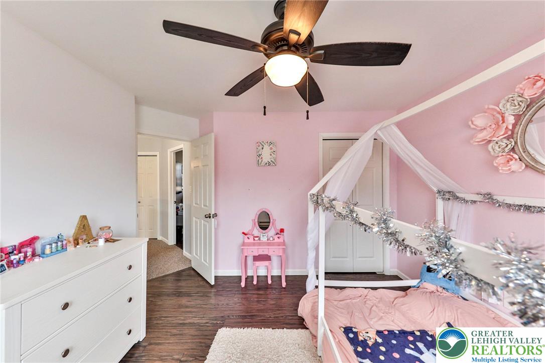 2260 Reo Drive Effort, PA 18330 - Photo 21 of 40 a living room with a bed furniture and a chandelier fan