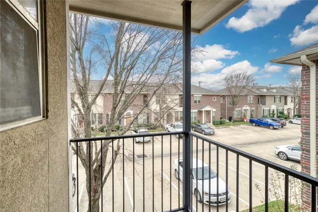 a view of a porch with a floor to ceiling window