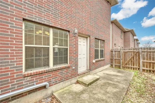 a view of a house with a backyard and porch