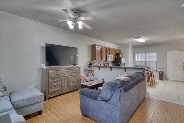 a living room with furniture and a flat screen tv