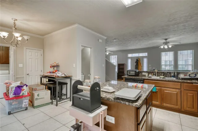 a kitchen that has a table and chairs in it