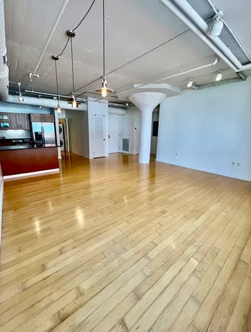 a view of a kitchen with a sink and microwave