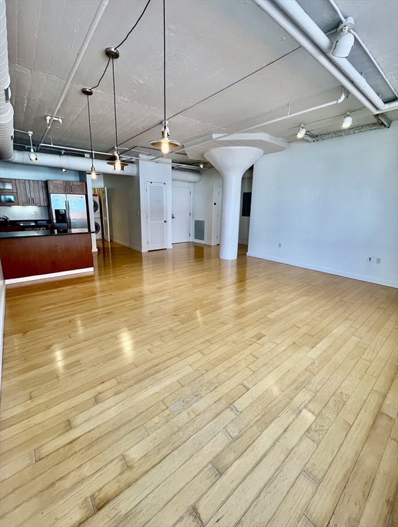 210 South Street, Unit 113 Boston, MA 02111 - Photo 13 of 17 a view of a kitchen with a sink and microwave