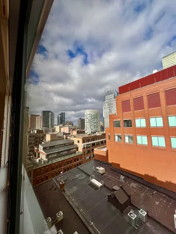 a view of a living room and kitchen