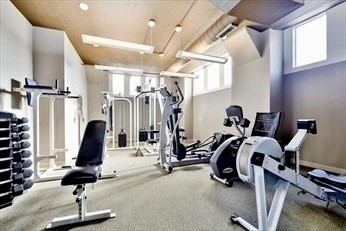 210 South Street, Unit 113 Boston, MA 02111 - Photo 5 of 17 a view of a room with gym equipment
