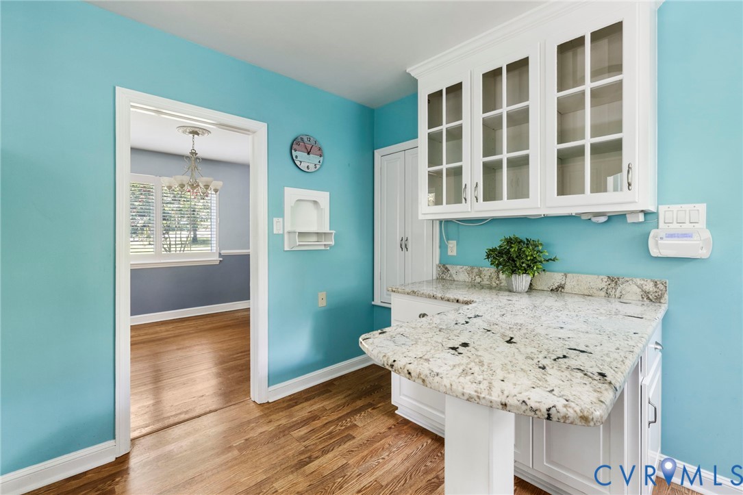 7644 Cherokee Road Richmond, VA 23225 - Photo 12 of 31 Kitchen featuring a chandelier, wood finished floo