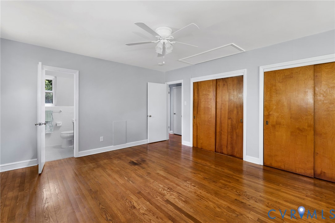 7644 Cherokee Road Richmond, VA 23225 - Photo 18 of 31 Unfurnished bedroom featuring attic access, two cl