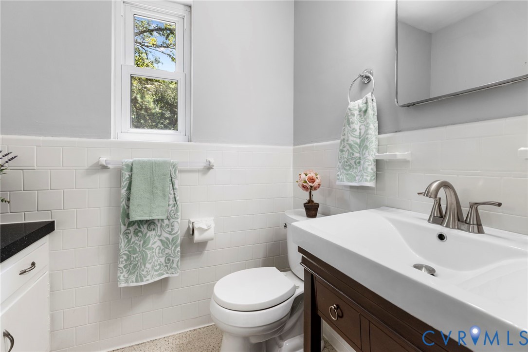 7644 Cherokee Road Richmond, VA 23225 - Photo 19 of 31 Bathroom featuring vanity, a wainscoted wall, spec