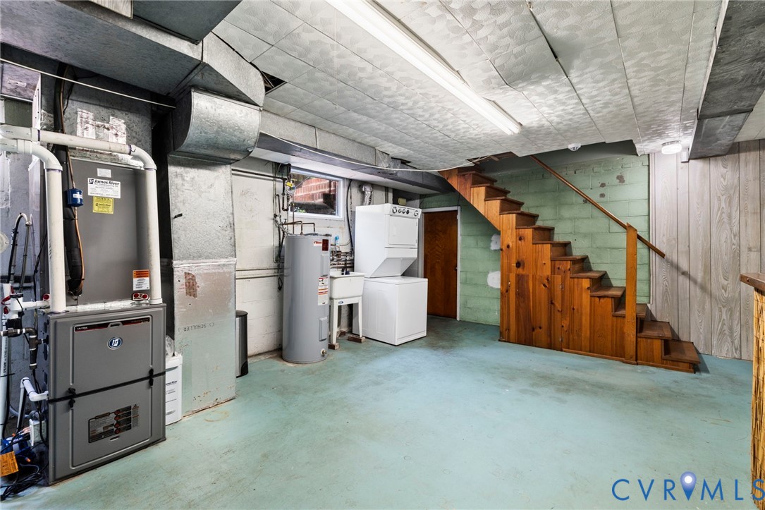 7644 Cherokee Road Richmond, VA 23225 - Photo 23 of 31 Below grade area with stacked washer and clothes d