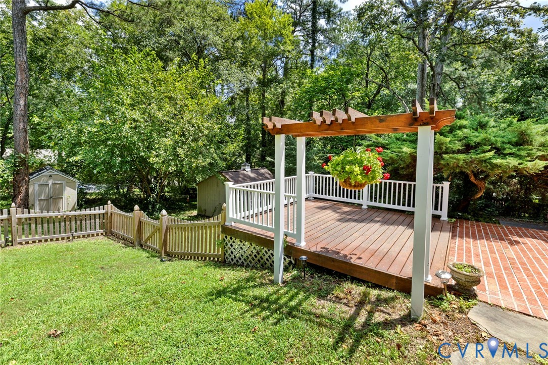7644 Cherokee Road Richmond, VA 23225 - Photo 27 of 31 Wooden deck featuring a storage shed and a pergola