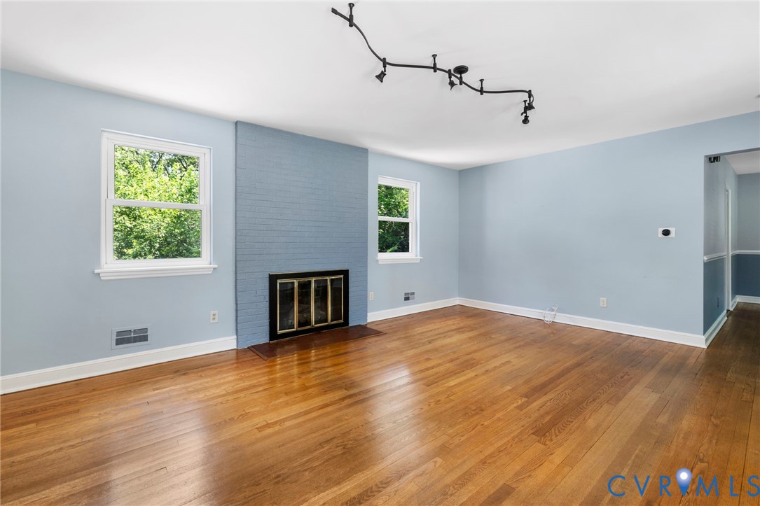 7644 Cherokee Road Richmond, VA 23225 - Photo 5 of 31 Unfurnished living room featuring hardwood / wood-