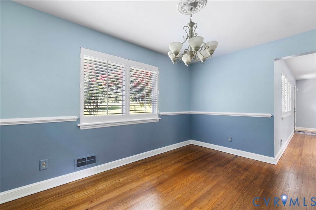 7644 Cherokee Road Richmond, VA 23225 - Photo 9 of 31 Unfurnished room with a chandelier, plenty of natu