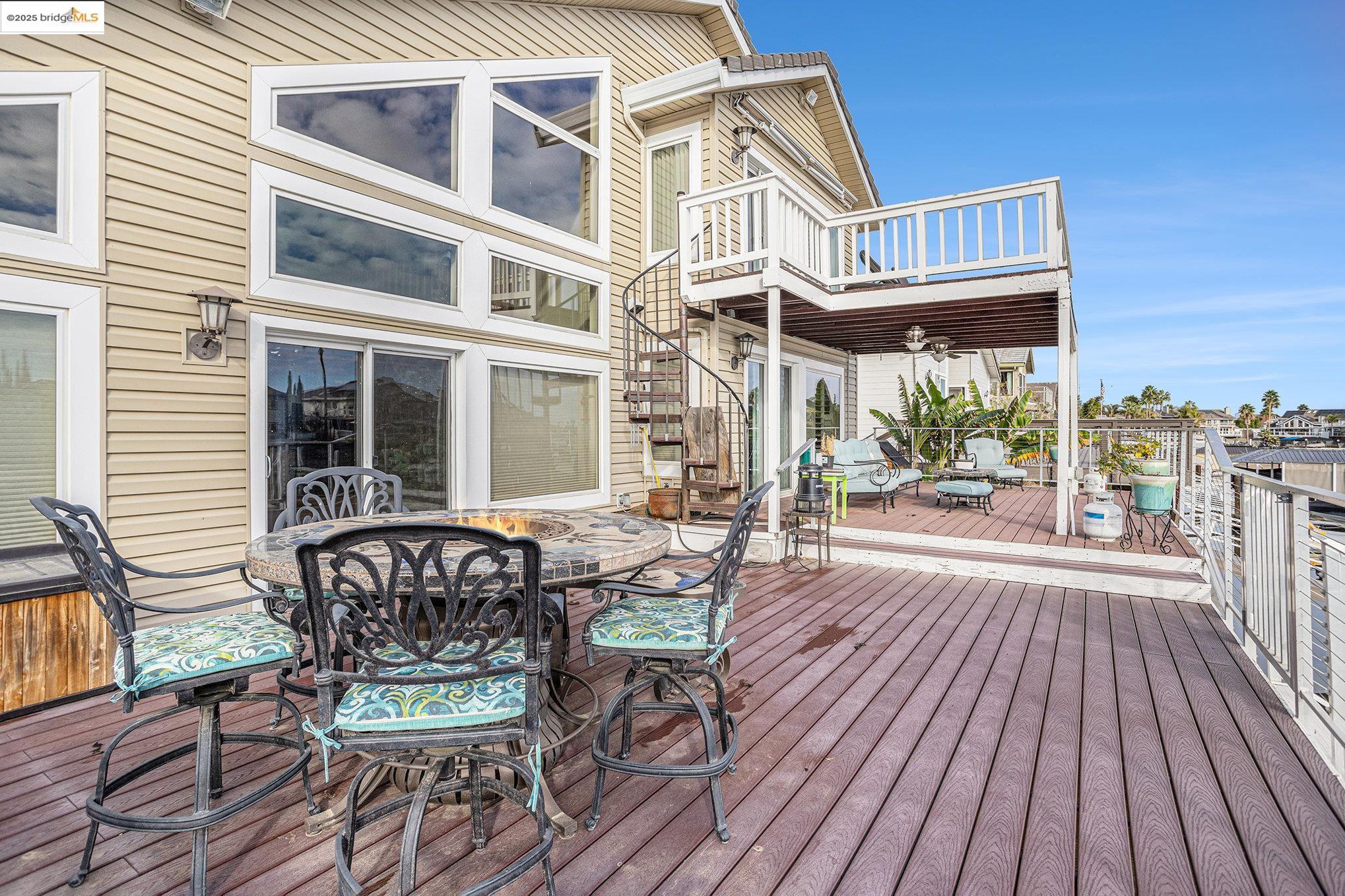 2011 Windward Point Discovery Bay, CA 94505 - Photo 5 of 19 a view of a patio with table and chairs and wooden floor