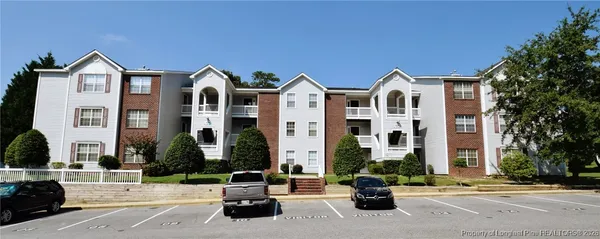 a front view of a building with street view