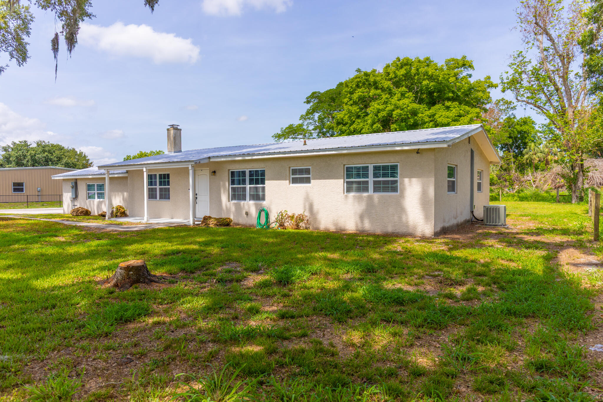2675 Southwest 24th Avenue Okeechobee, FL 34974 - Photo 14 of 60 a view of a house with a backyard