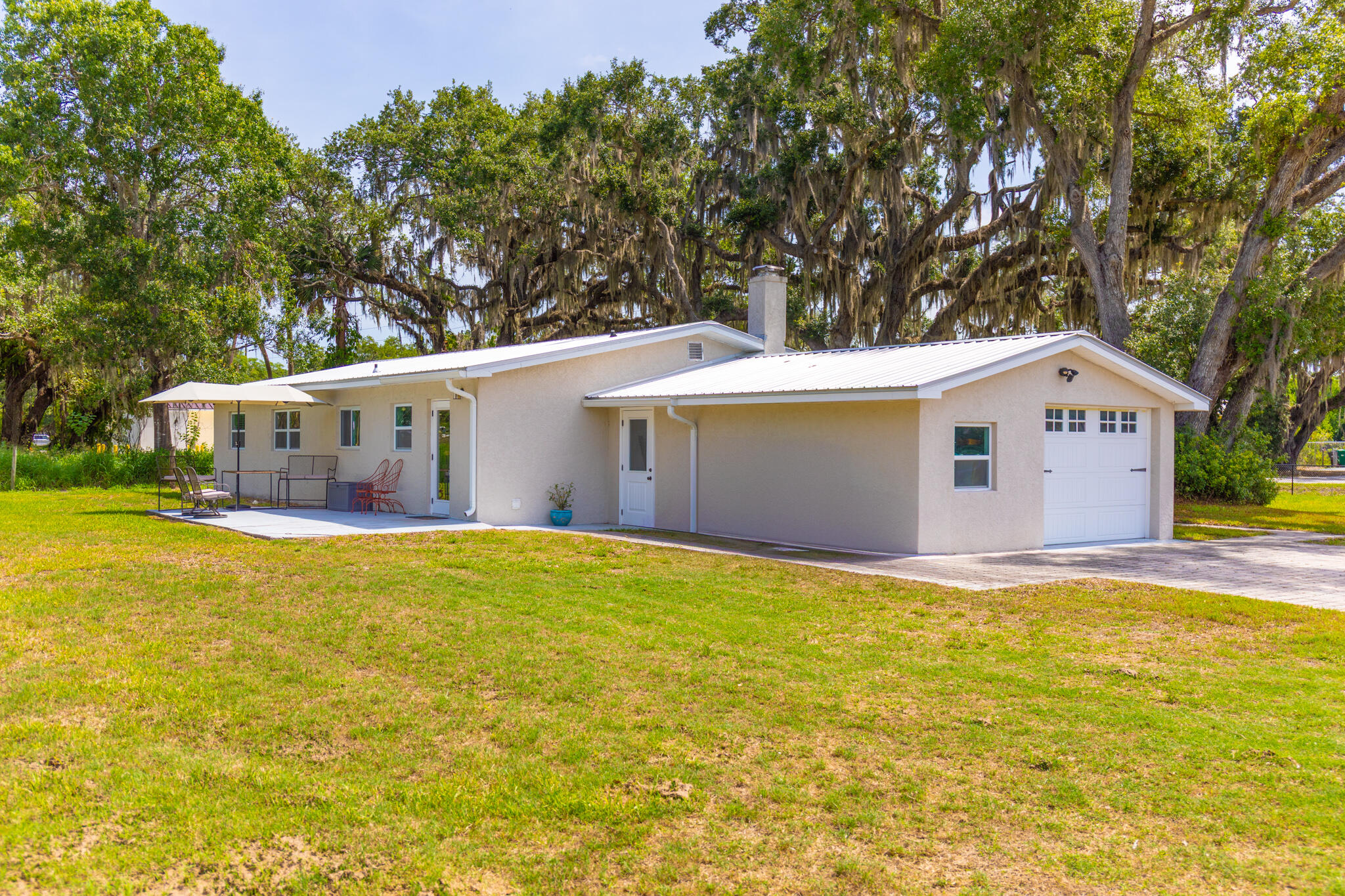2675 Southwest 24th Avenue Okeechobee, FL 34974 - Photo 18 of 60 a view of a house with a yard