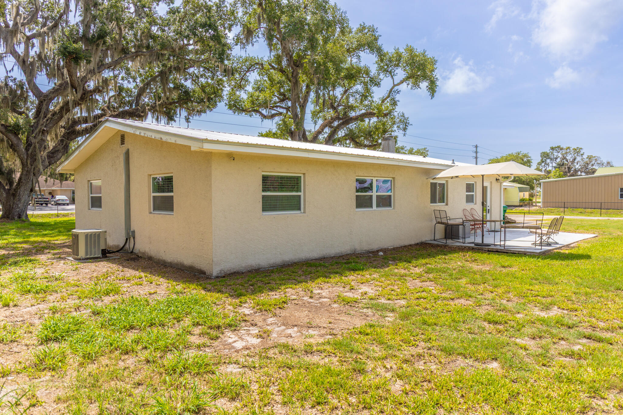 2675 Southwest 24th Avenue Okeechobee, FL 34974 - Photo 22 of 60 a view of a house with a backyard