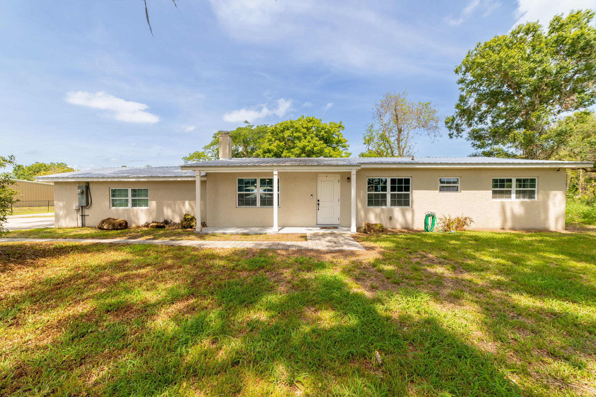 2675 Southwest 24th Avenue Okeechobee, FL 34974 - Photo 27 of 60 front view of a house with a patio