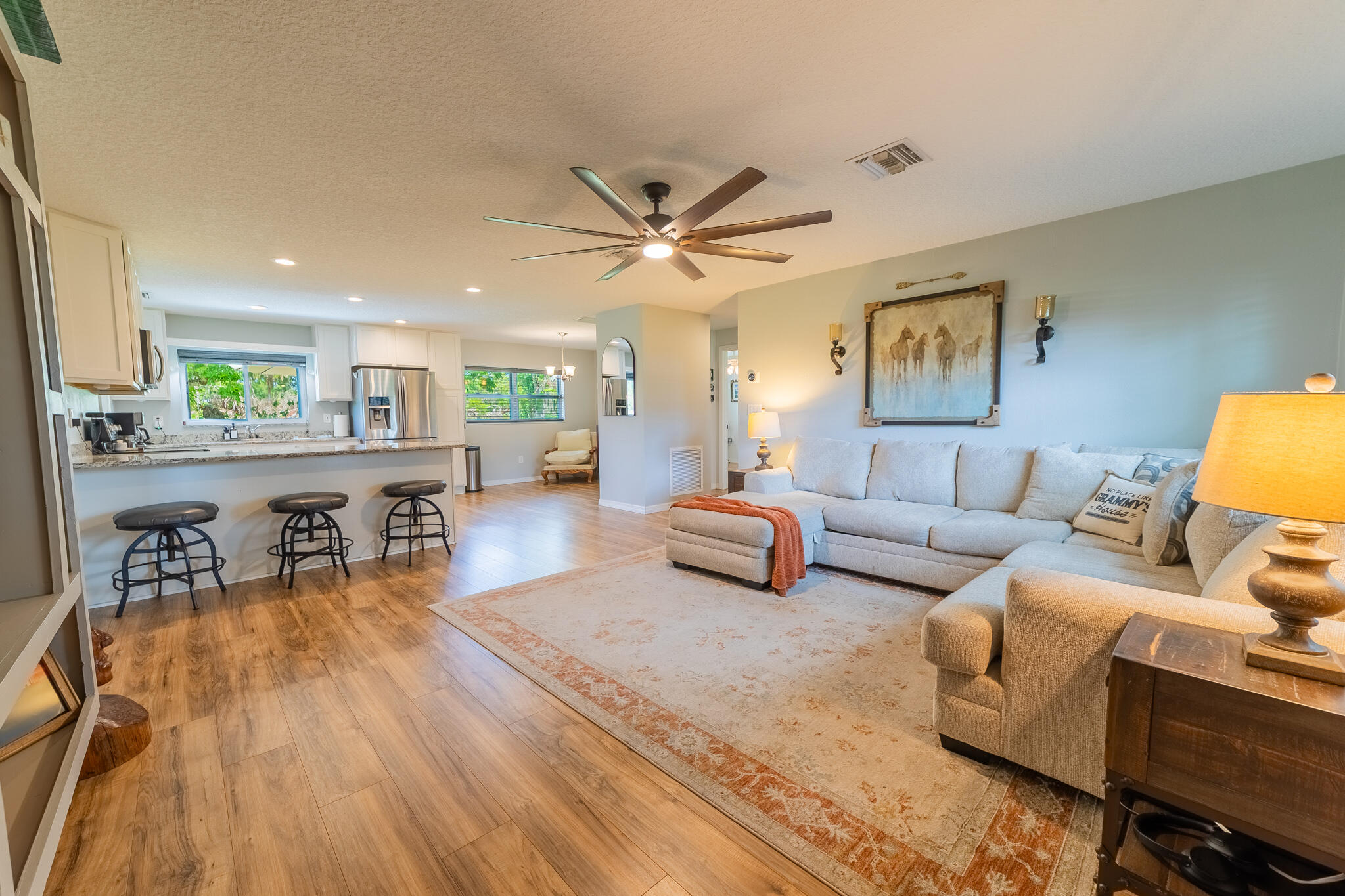 2675 Southwest 24th Avenue Okeechobee, FL 34974 - Photo 30 of 60 a living room with furniture and a wooden floor