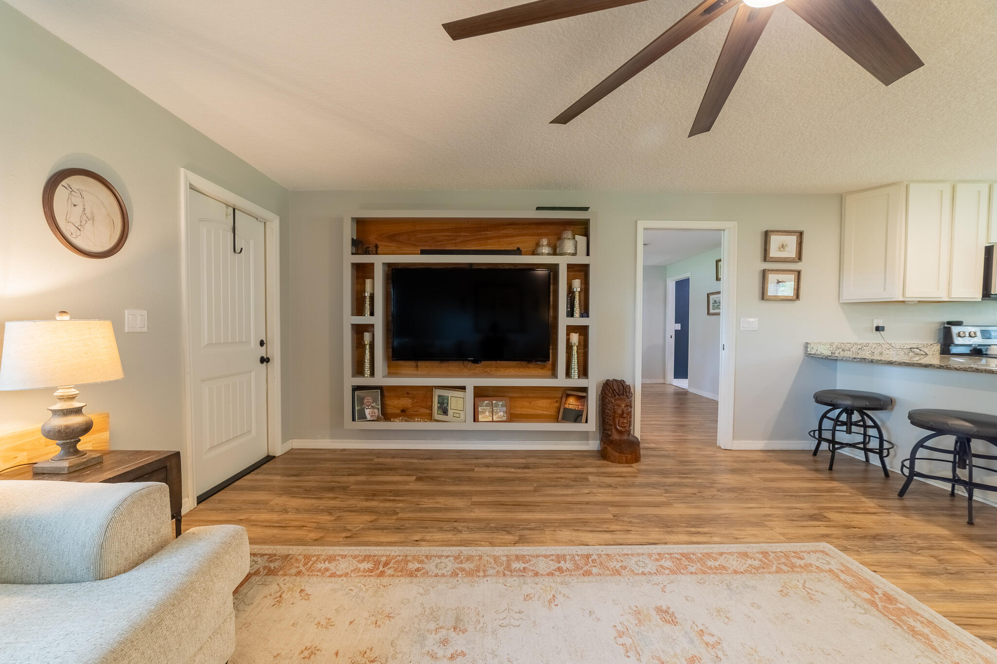 2675 Southwest 24th Avenue Okeechobee, FL 34974 - Photo 33 of 60 a living room with furniture and a flat screen tv