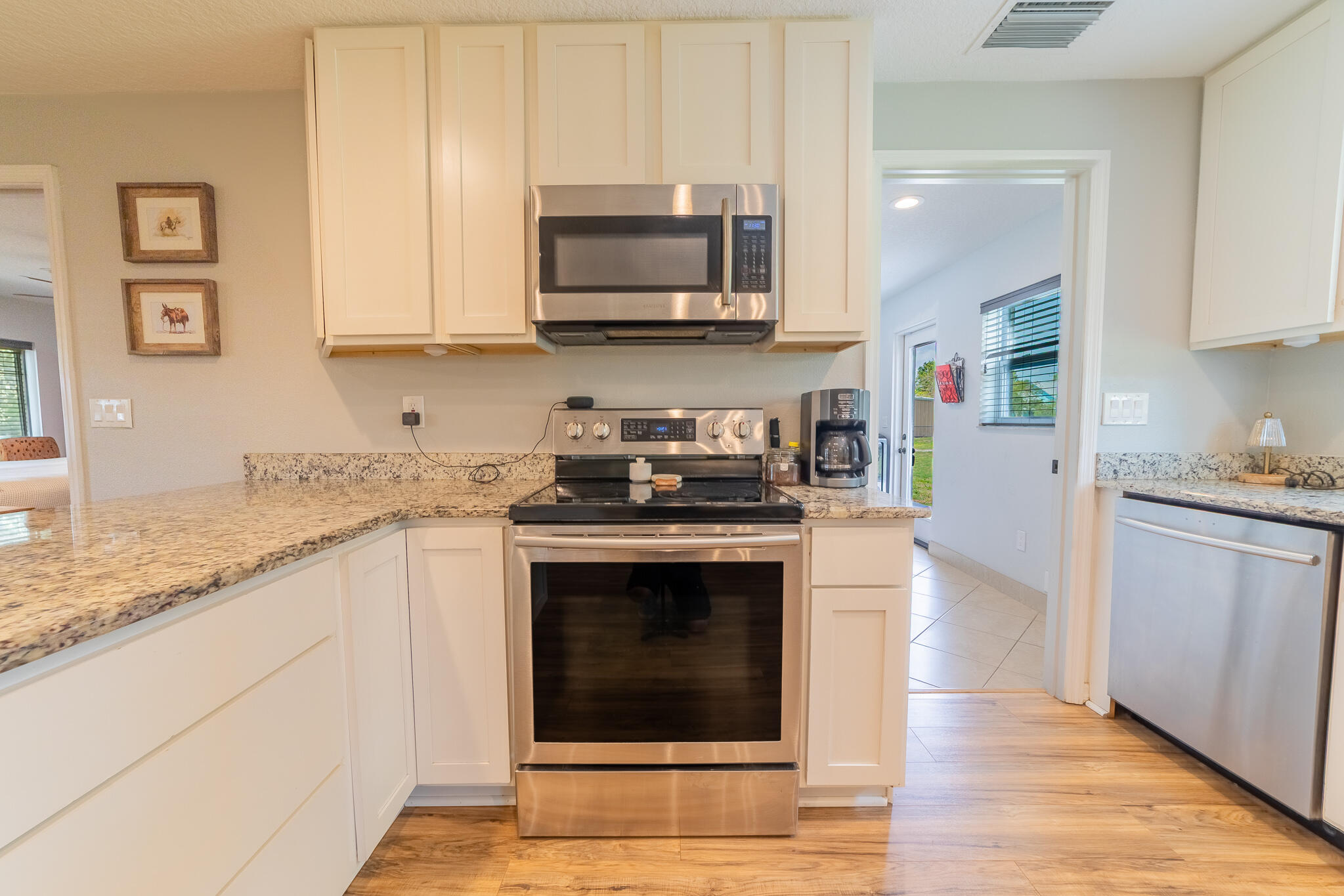 2675 Southwest 24th Avenue Okeechobee, FL 34974 - Photo 37 of 60 a kitchen with stainless steel appliances granite countertop a stove and a sink