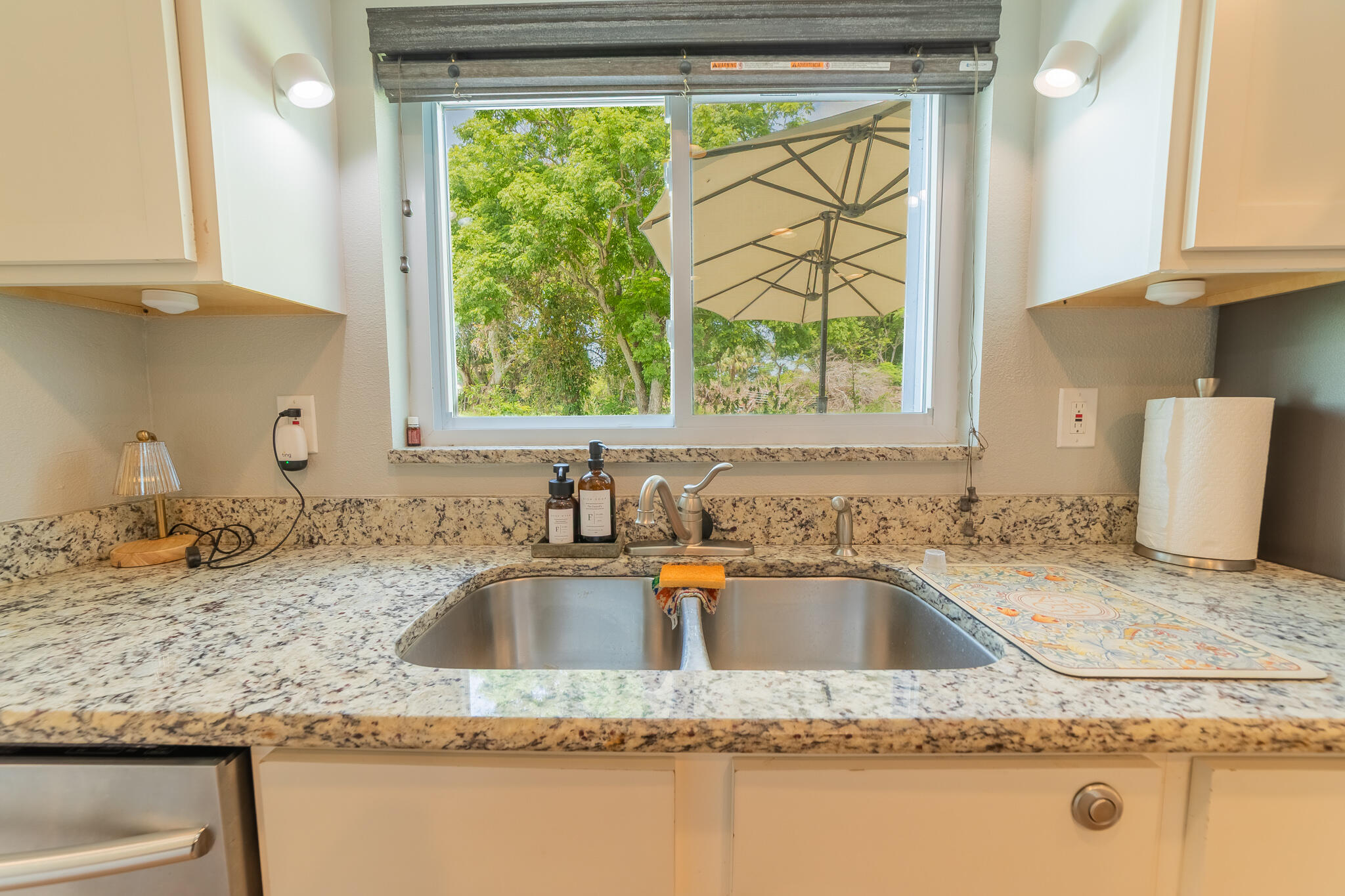 2675 Southwest 24th Avenue Okeechobee, FL 34974 - Photo 38 of 60 a kitchen with a granite countertop sink and window