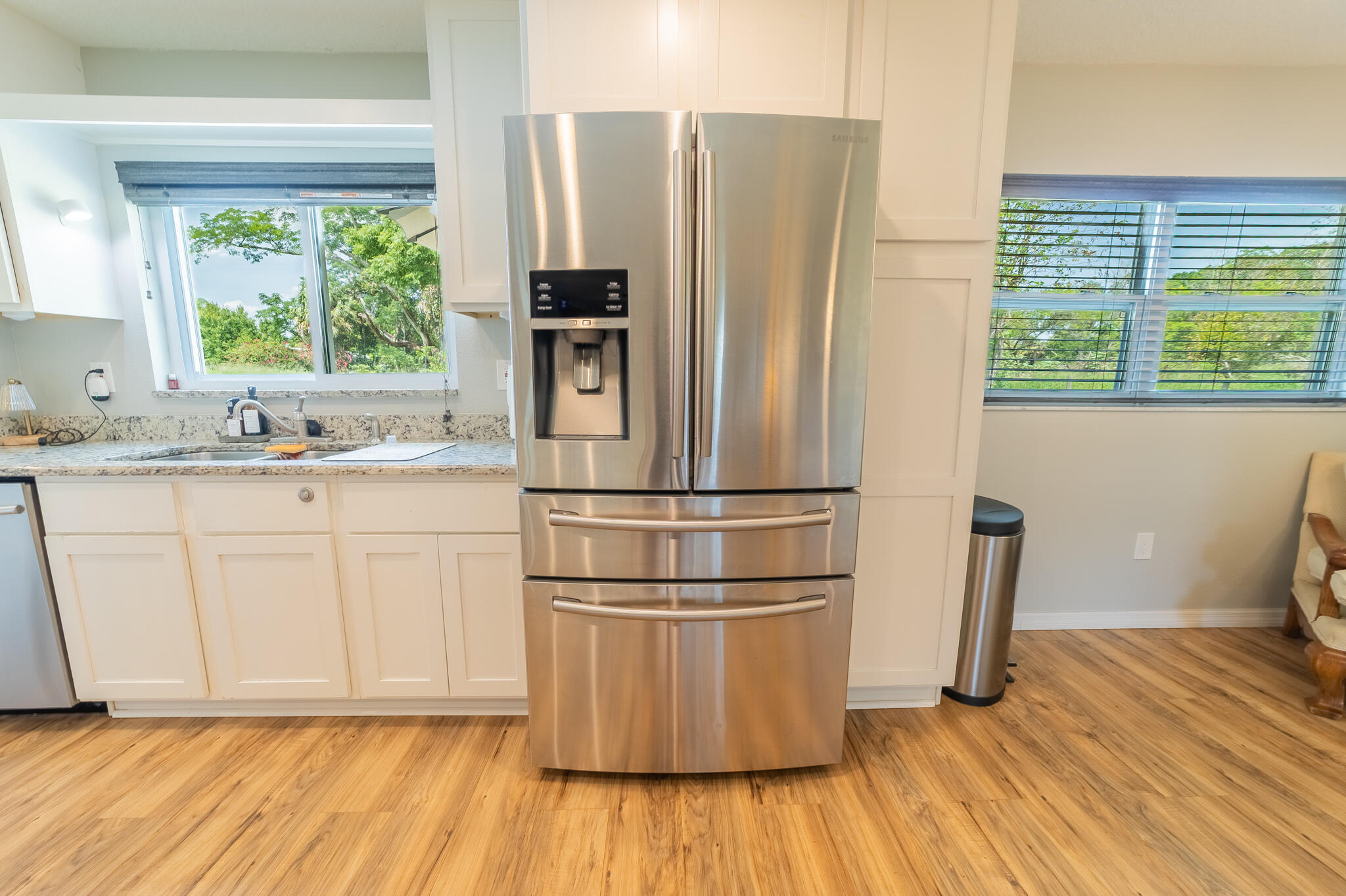2675 Southwest 24th Avenue Okeechobee, FL 34974 - Photo 39 of 60 a kitchen with stainless steel appliances a refrigerator sink and cabinets