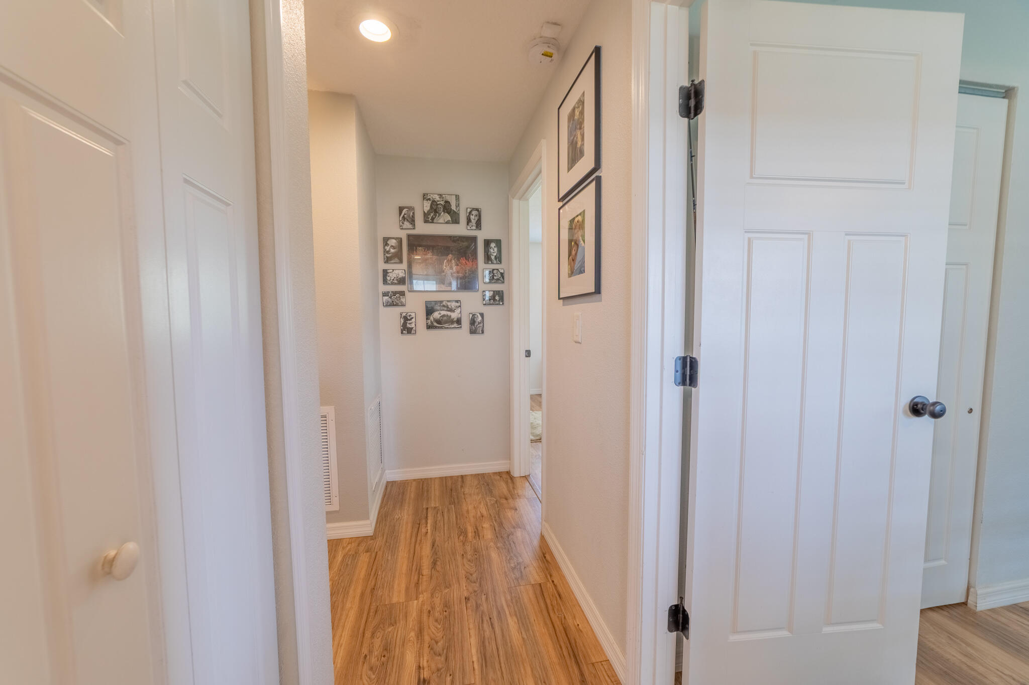 2675 Southwest 24th Avenue Okeechobee, FL 34974 - Photo 44 of 60 a view of a hallway with wooden floor and a bathroom