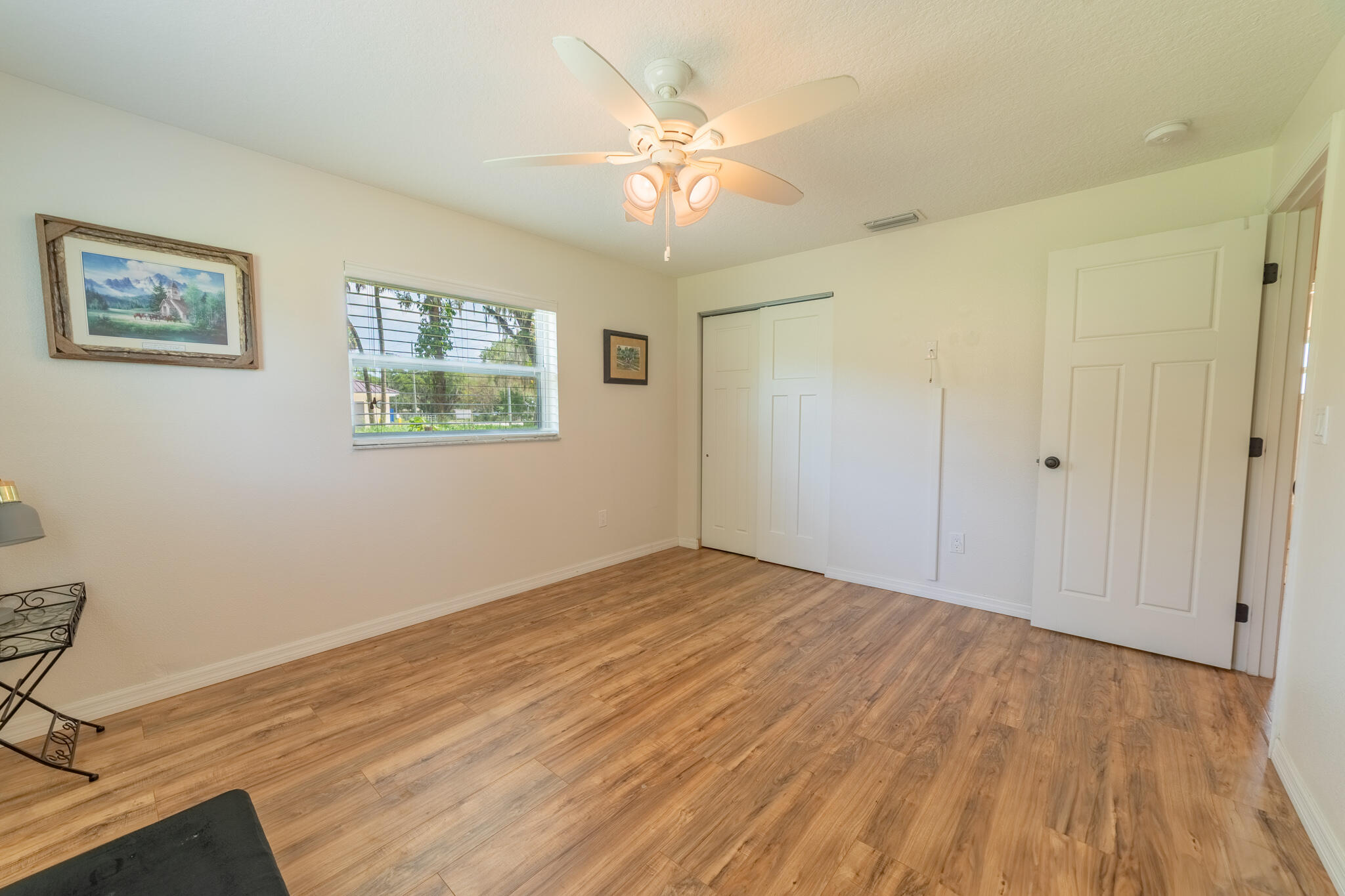 2675 Southwest 24th Avenue Okeechobee, FL 34974 - Photo 55 of 60 a view of an empty room with a window and a ceiling fan