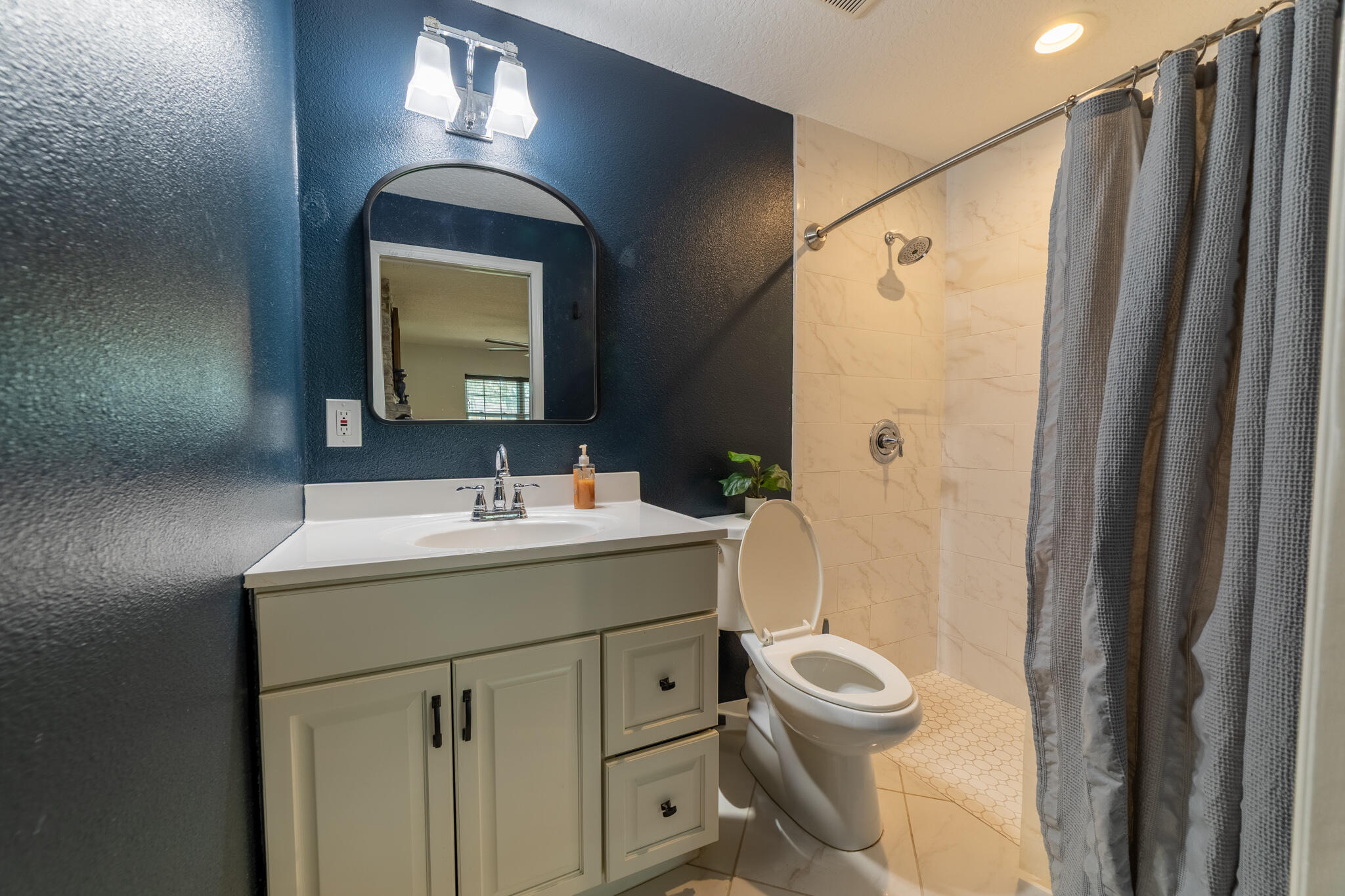 2675 Southwest 24th Avenue Okeechobee, FL 34974 - Photo 60 of 60 a bathroom with a granite countertop sink toilet and shower