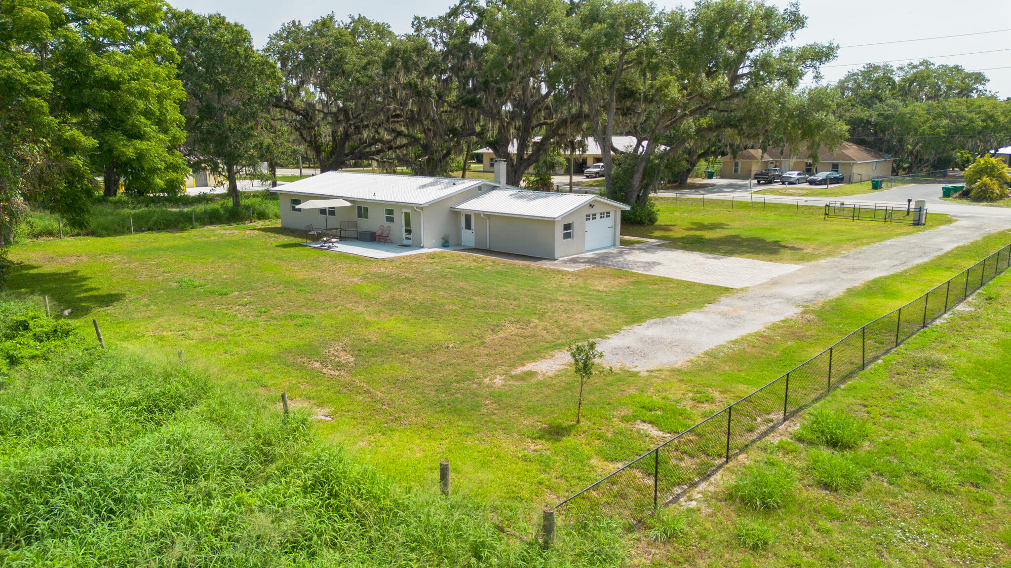 2675 Southwest 24th Avenue Okeechobee, FL 34974 - Photo 7 of 60 a view of a swimming pool with a yard and trees