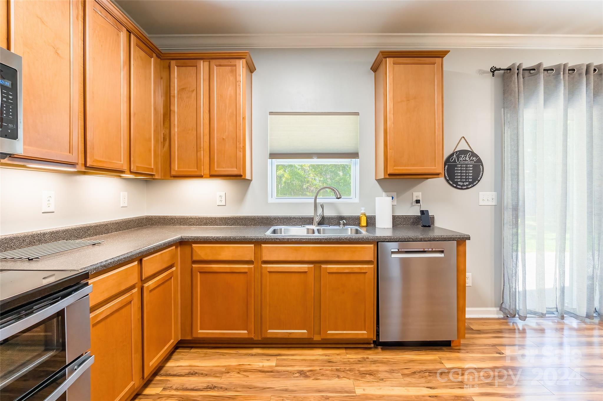 2901 Liddington Road Matthews, NC 28105 - Photo 13 of 37 a kitchen with stainless steel appliances granite countertop a sink a stove and a microwave