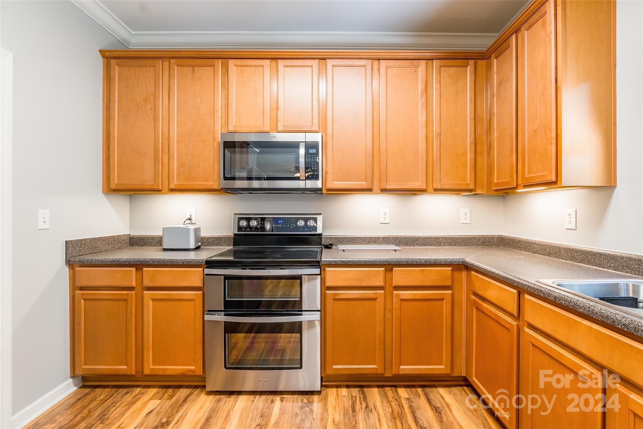 2901 Liddington Road Matthews, NC 28105 - Photo 14 of 37 a kitchen with stainless steel appliances granite countertop a stove a sink and a microwave