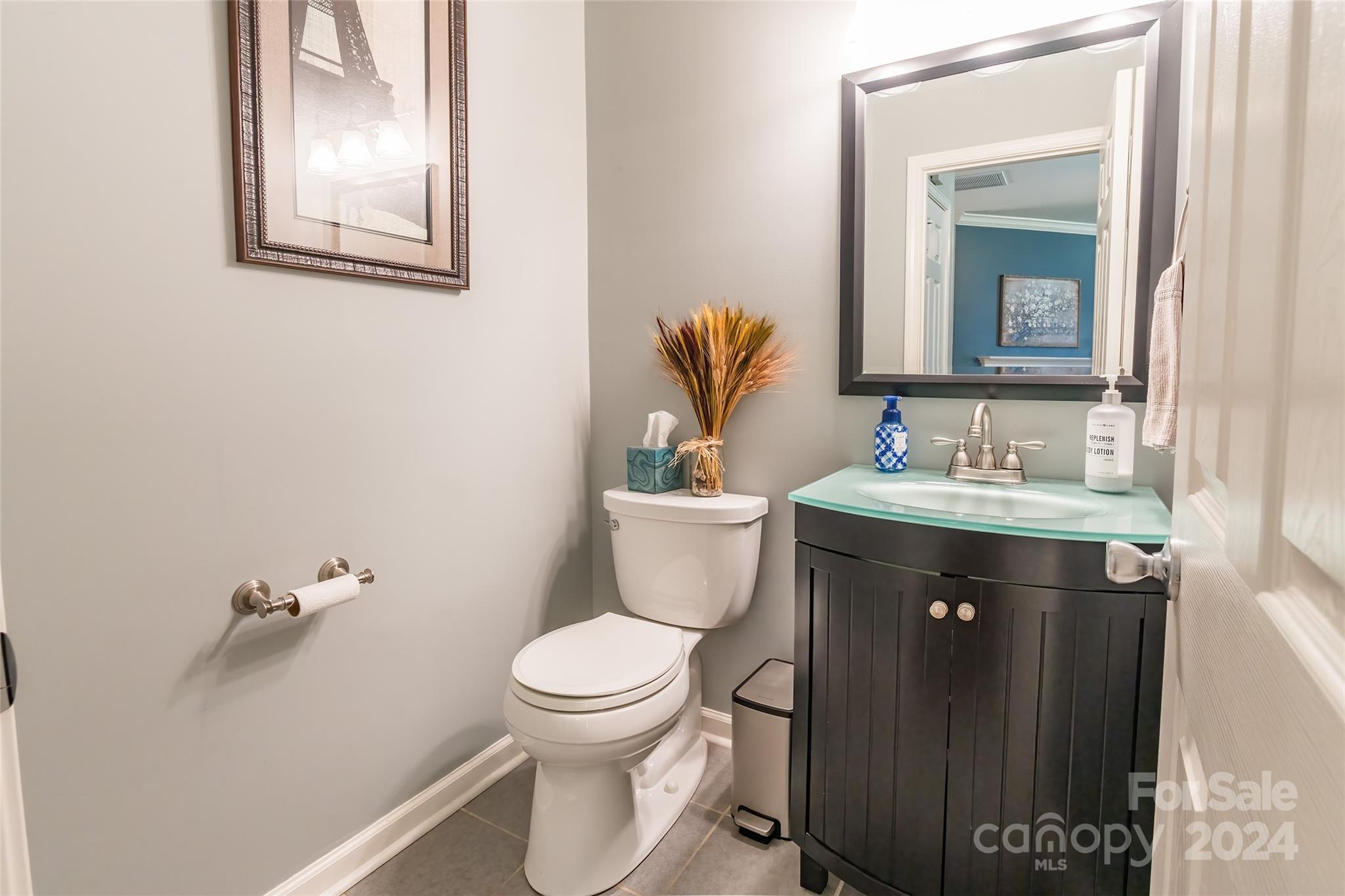 2901 Liddington Road Matthews, NC 28105 - Photo 17 of 37 a bathroom with a granite countertop toilet sink and mirror